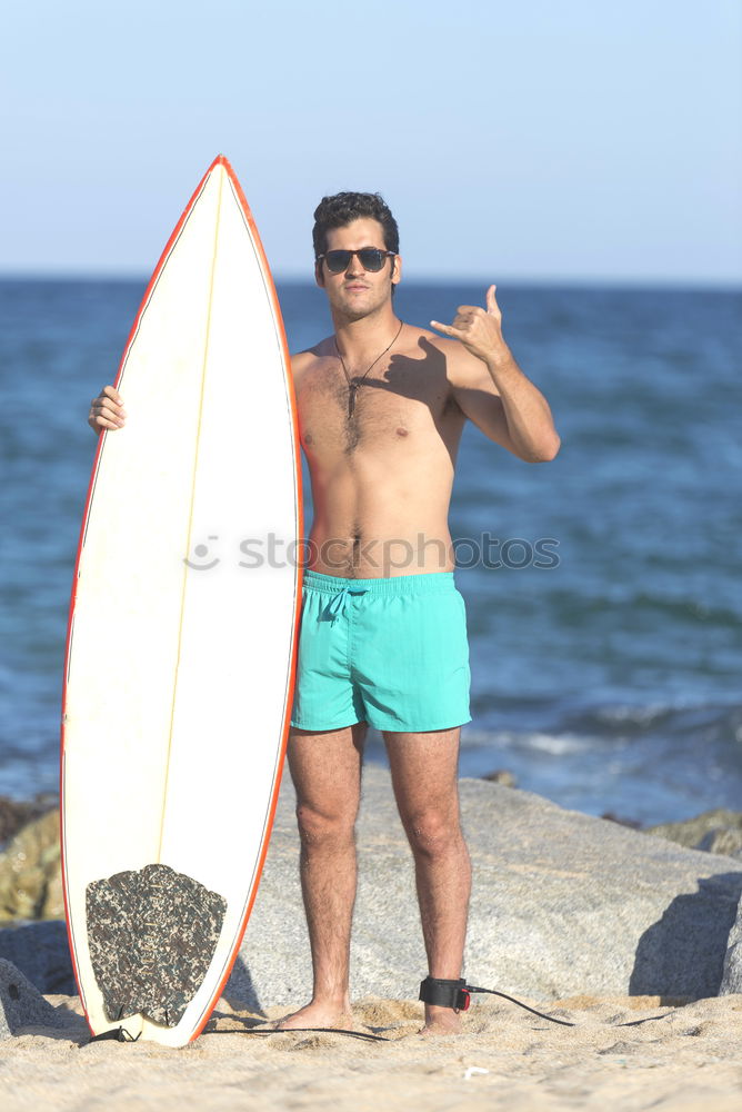 Similar – Young attractive surfer holding his surfboard at the beach