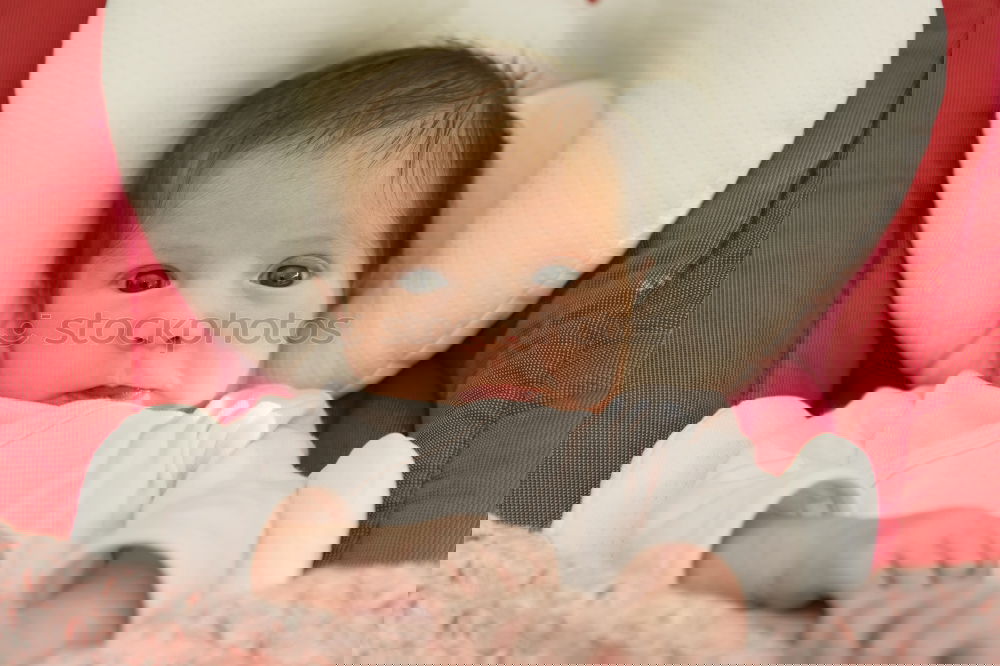 Similar – Image, Stock Photo Baby girl two months old looking at a doll