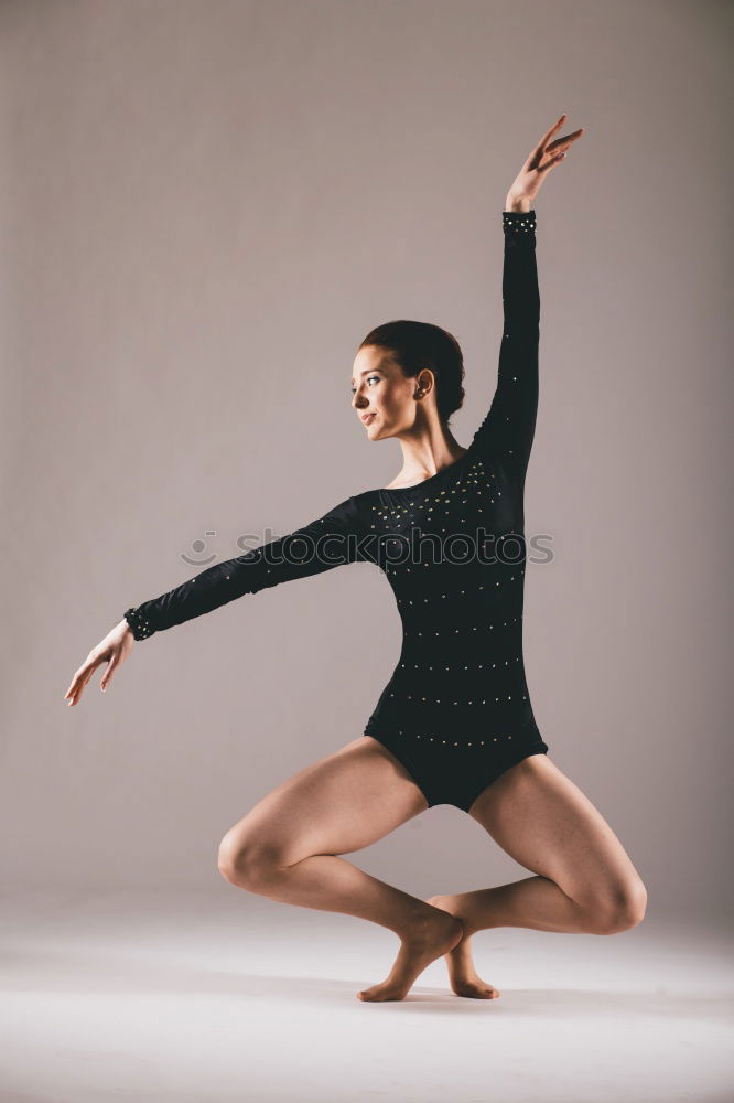 Similar – Ballet dancer posing at street