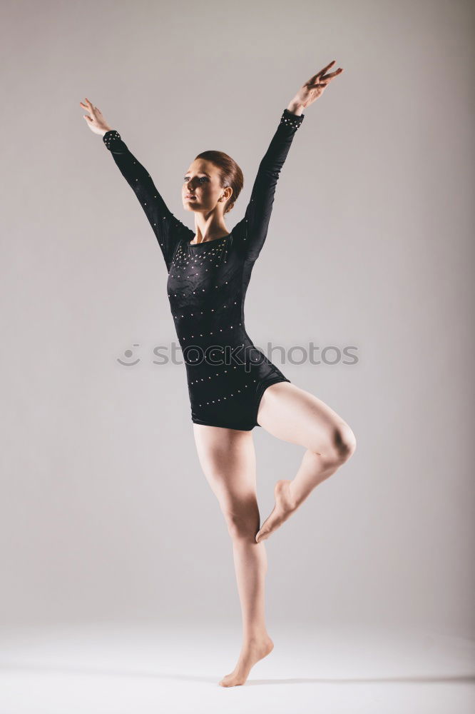 Similar – Ballet dancer posing at street