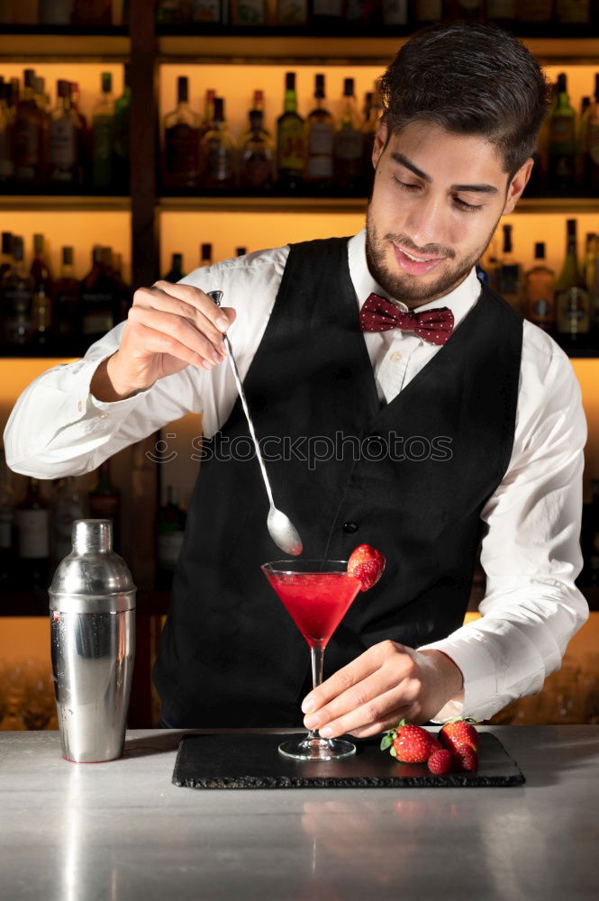 Similar – Barman is making cocktail at night club.