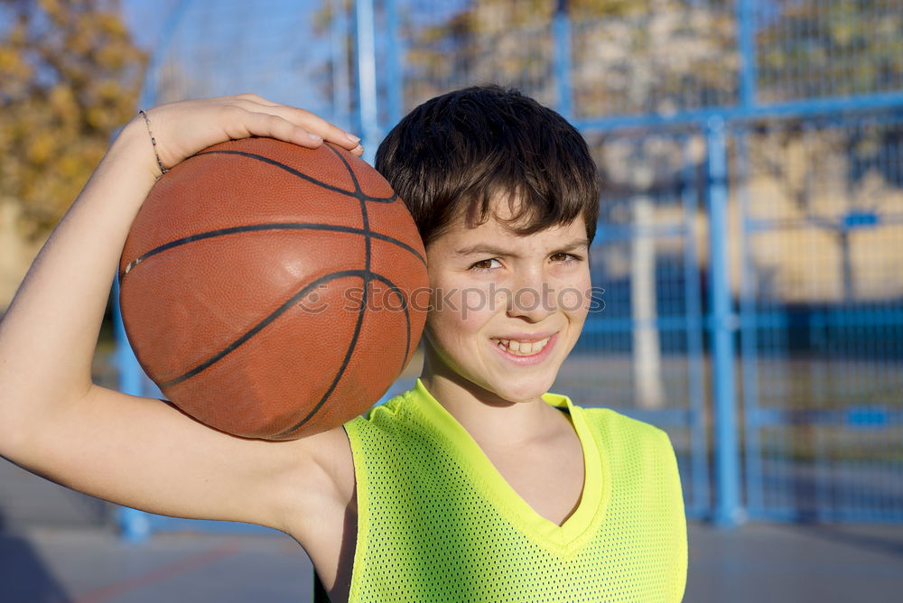 Similar – Teenage playing basketball on an outdoors court