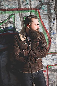 Similar – Image, Stock Photo Man standing at house with graffiti