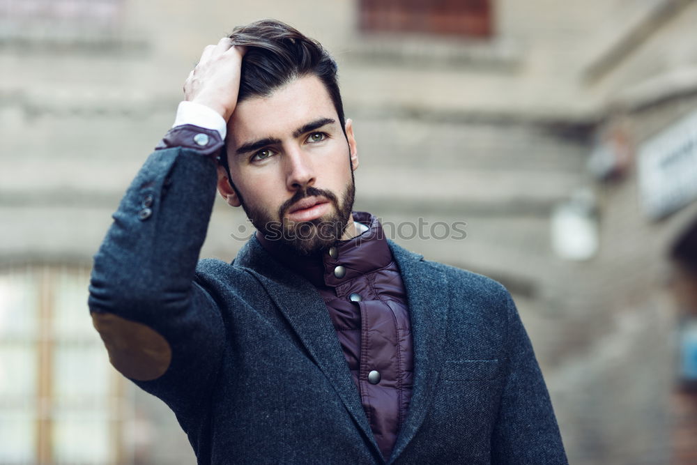 Similar – Young smiling man, model of fashion, wearing a plaid shirt with a green blind behind him