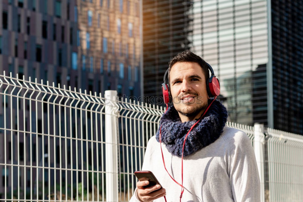 Similar – Image, Stock Photo Young man waiting listening music and using mobile phone at the airport with a suitcase.