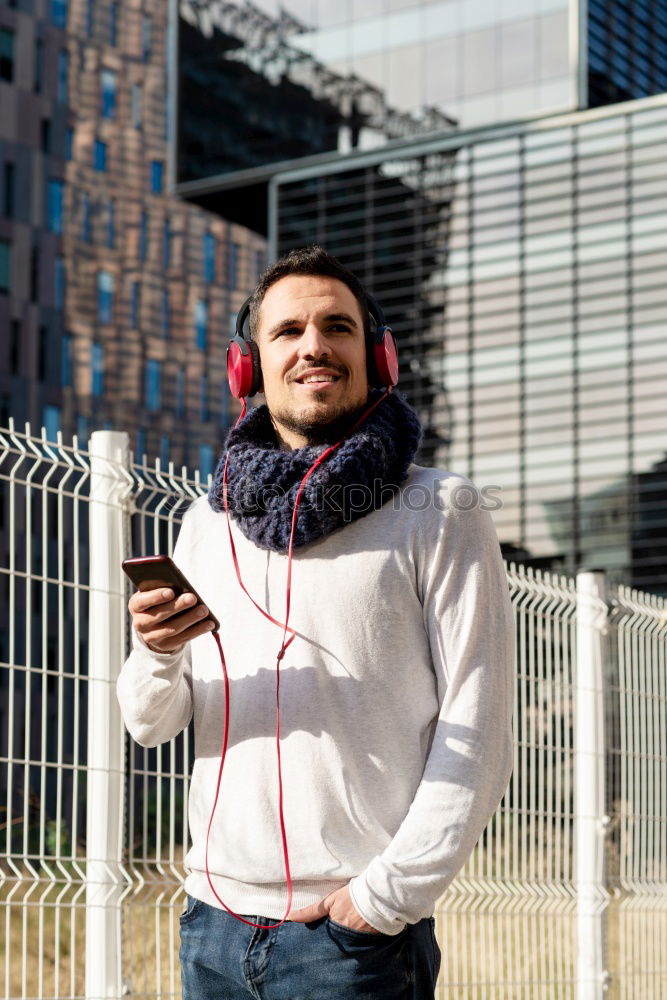 Similar – Image, Stock Photo Young man waiting listening music and using mobile phone at the airport with a suitcase.