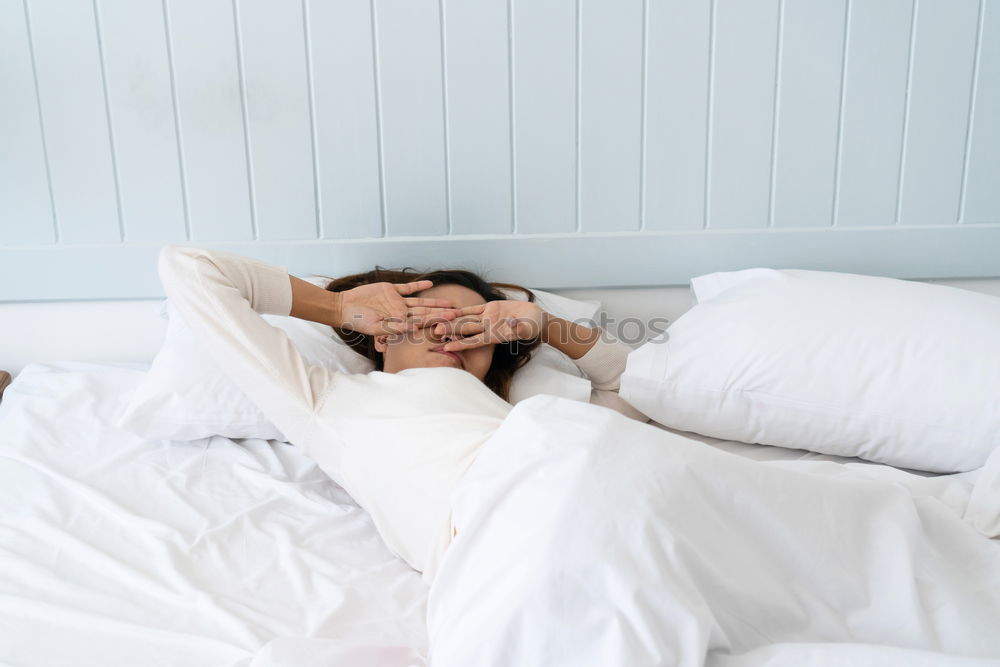 Similar – Little girl lying in a bed with teddy bear at the morning