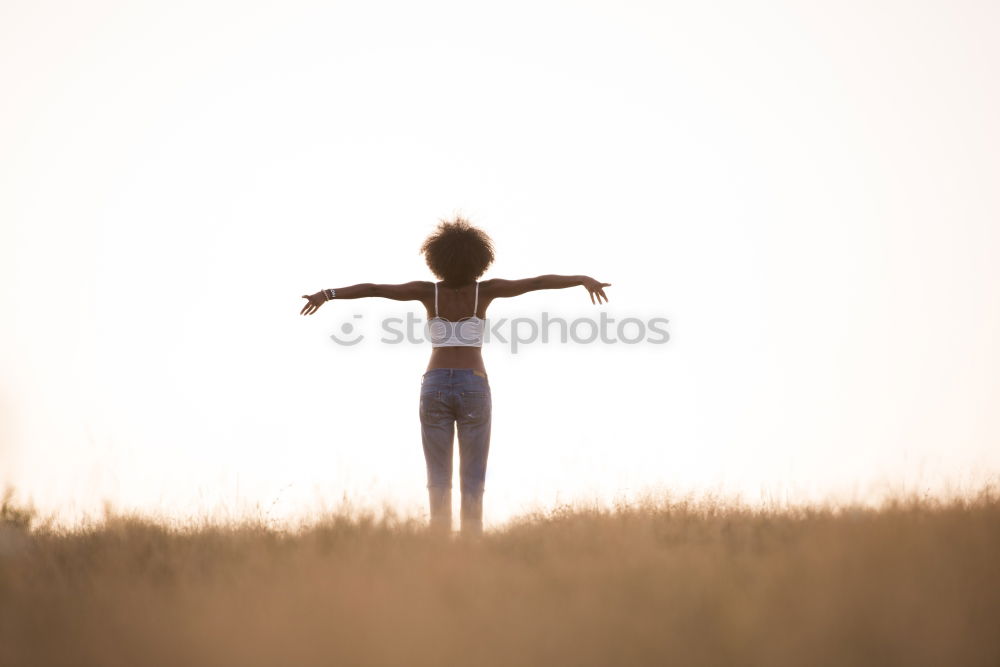 Similar – Young woman posing on a hill