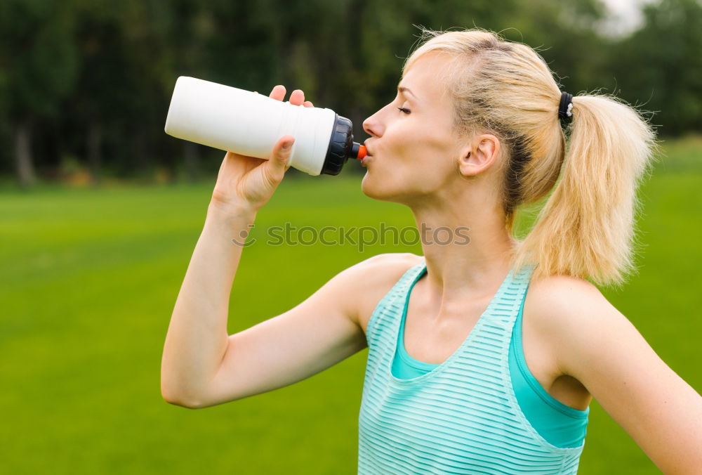 Similar – Athletic Women Drinking Water After an Exercise