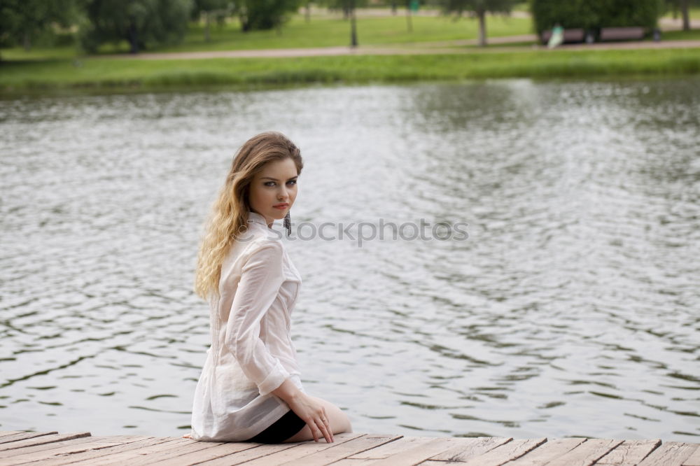 Similar – Young woman standing in the river Rhine