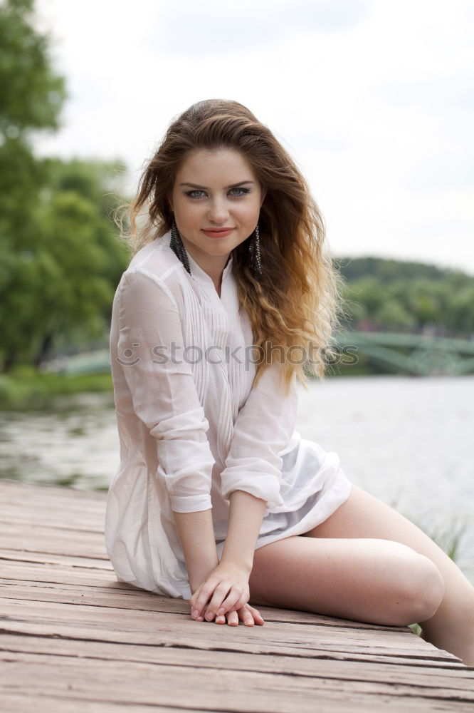 Similar – Image, Stock Photo young woman in summer dress sits among bushes and grass barefoot in nature