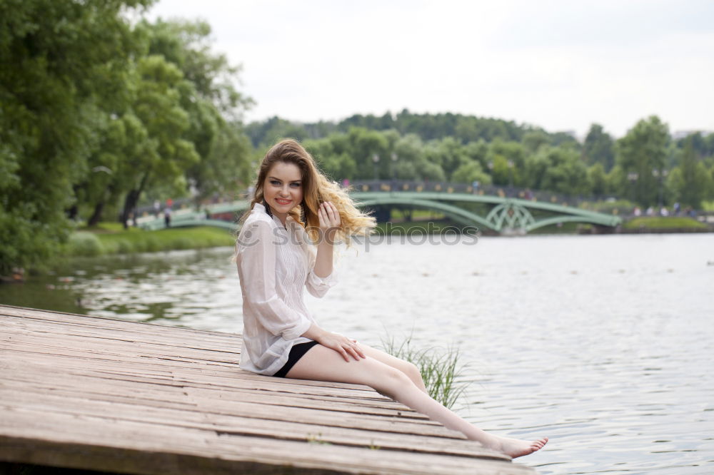 Similar – Young woman standing in the river Rhine