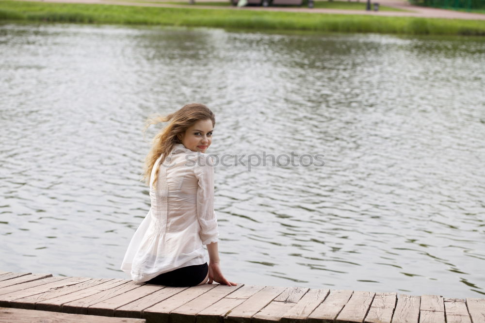 Similar – Woman with sunglasses plays with water