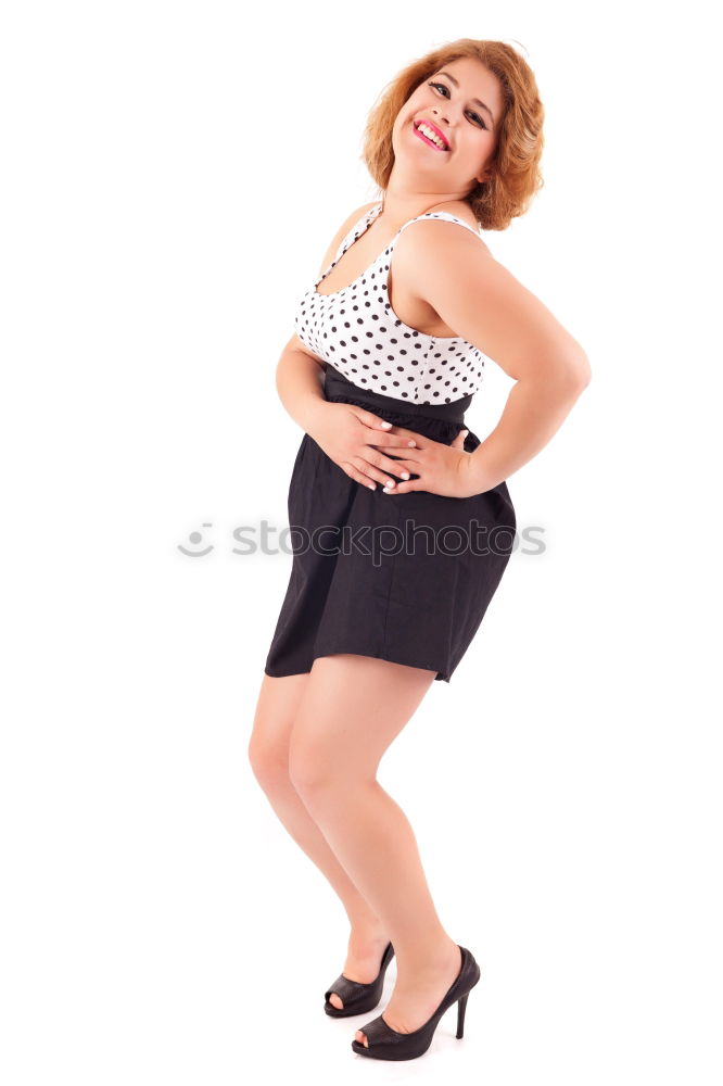 Similar – young redhead woman with curls and freckles stands barefoot in hot pants in front of white door and smiles