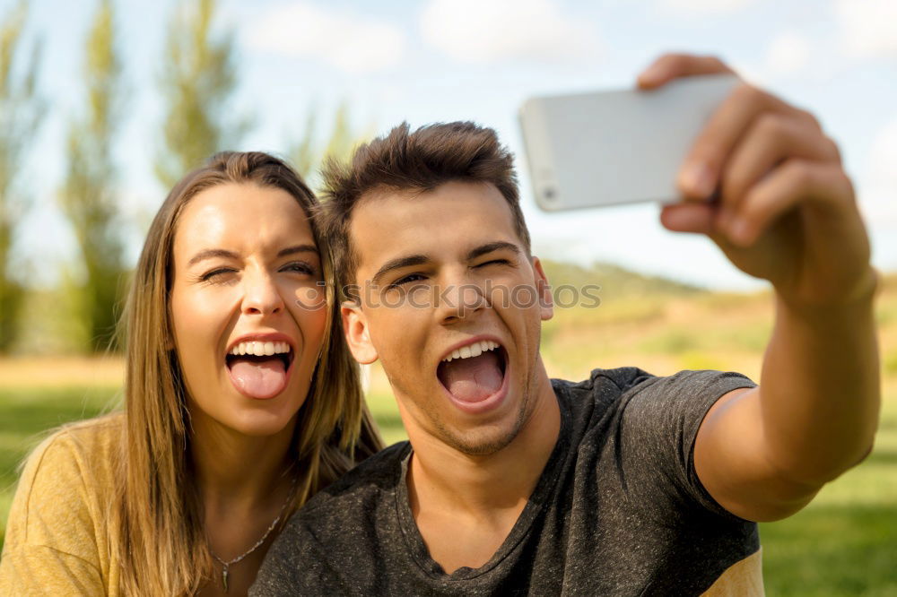 Image, Stock Photo Romantic Young Couple taking a photo with mobile phone.