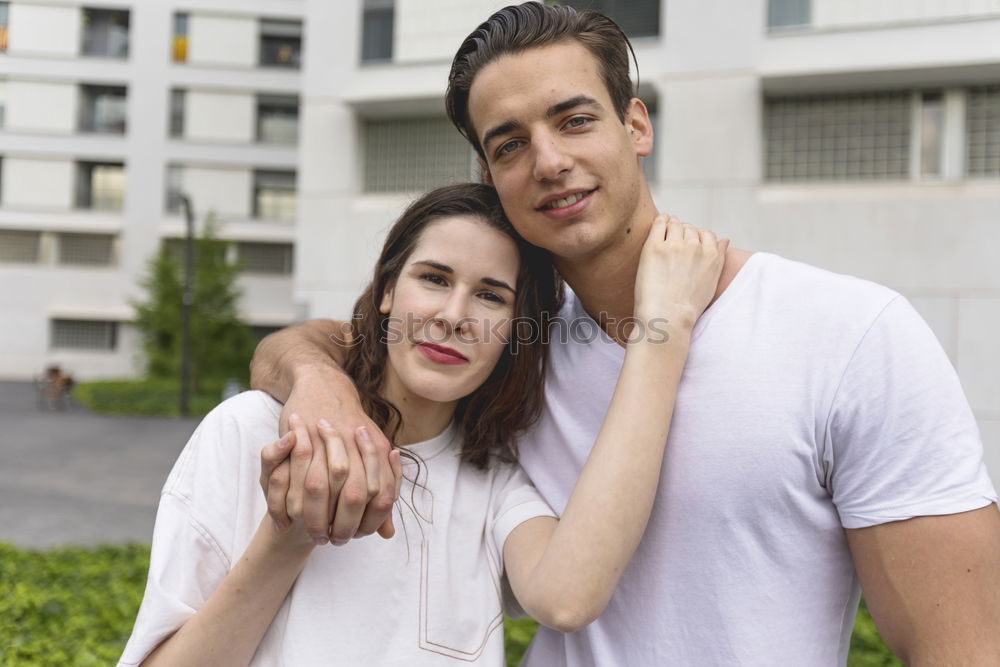 Young beautiful couple posing wearing jeans and t-shirt