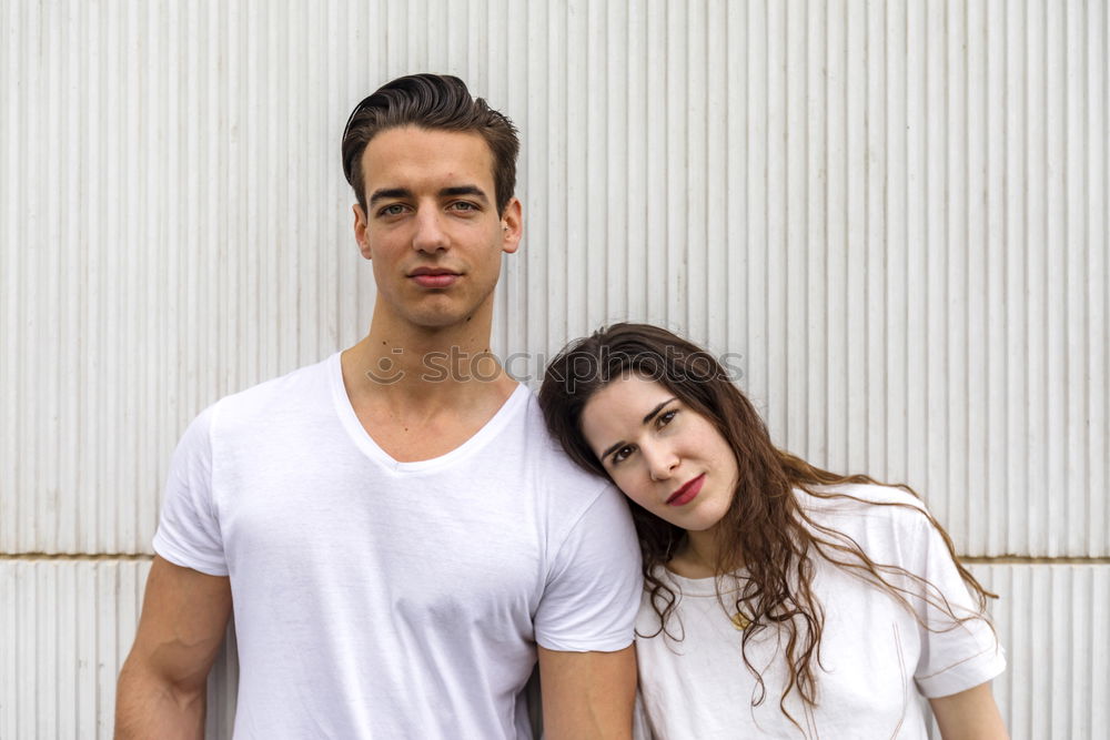 Image, Stock Photo Beautiful young couple hugging, looking at camera and smiling