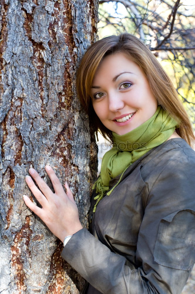 Similar – Image, Stock Photo Woman with knitted hat and coat hugs a tree, dreaming in nature.