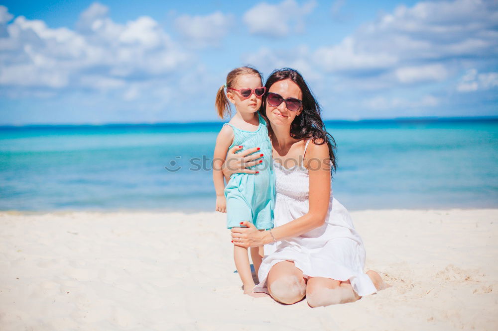 Similar – Image, Stock Photo Happy father and son playing on the beach at the day time. Concept of friendly family.