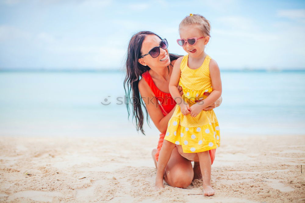 Similar – Image, Stock Photo Mother and toddler son playing with toys at beach