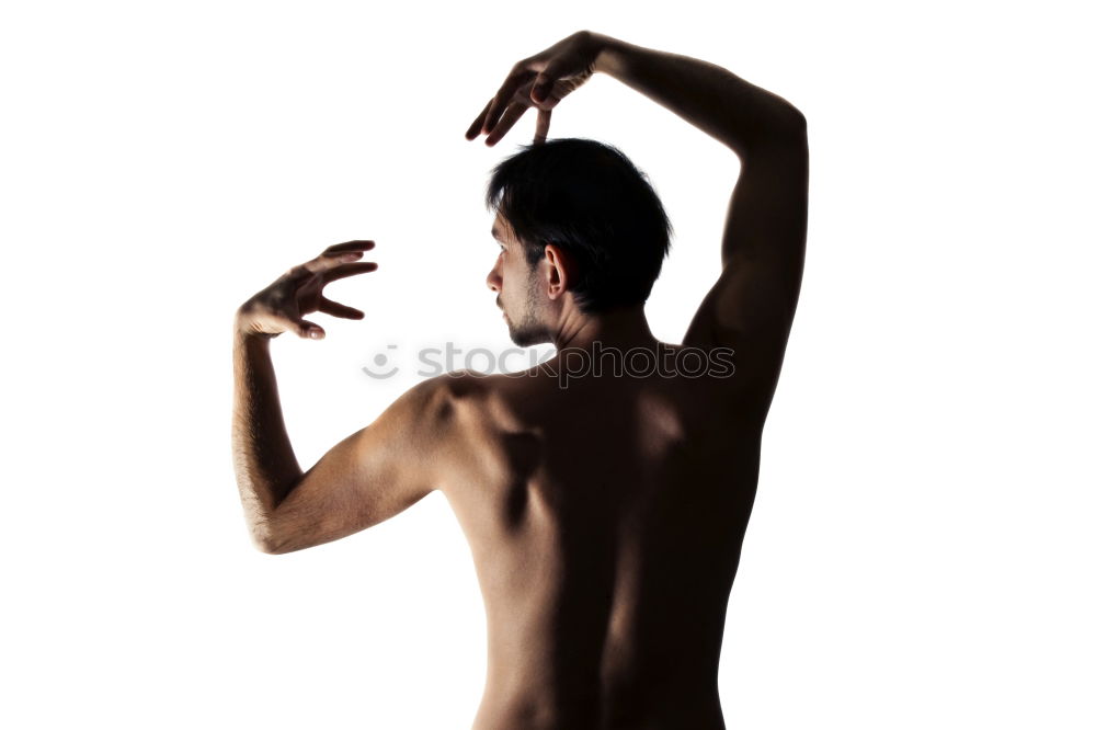 Similar – young woman with very short hair stands naked in front of light turquoise wall in pose with half raised arms