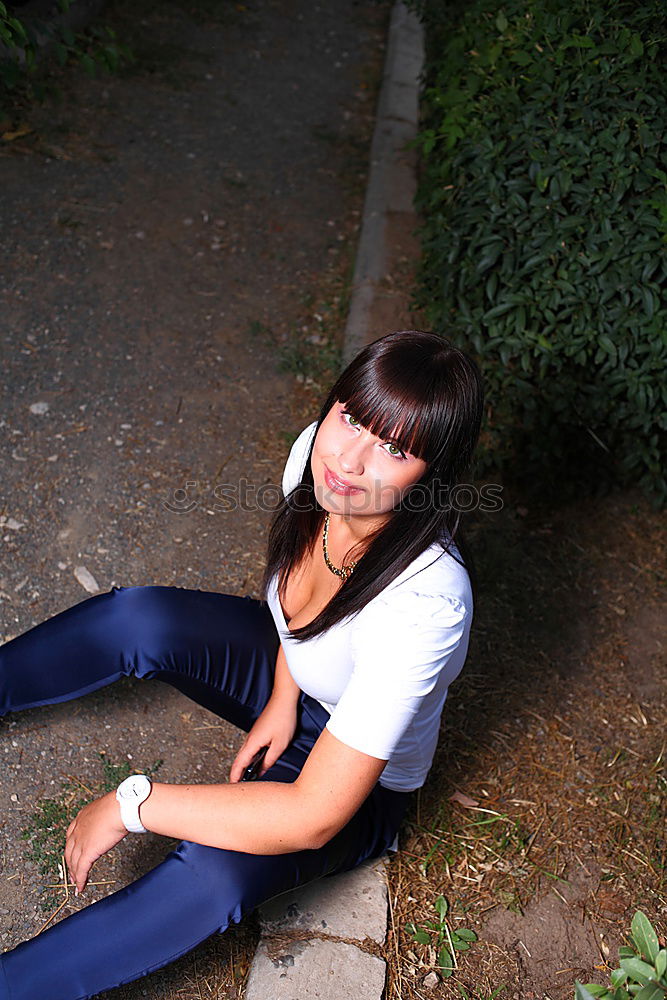 Similar – A young woman sitting on a garden bench