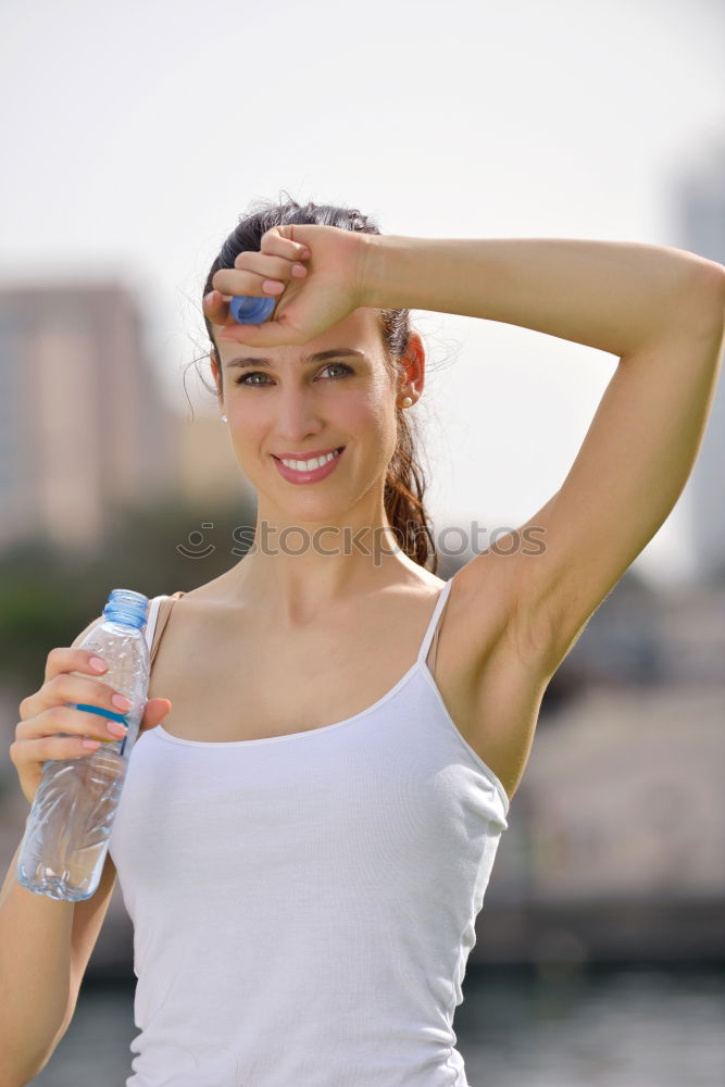 Similar – Fit sporty woman drinking water from a bottle