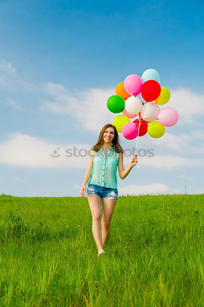 Similar – Image, Stock Photo Woman holding the Gay Rainbow Flag on green meadow outdoor