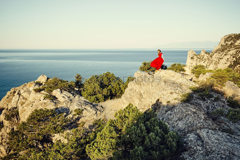 Similar – Man taking shot of island