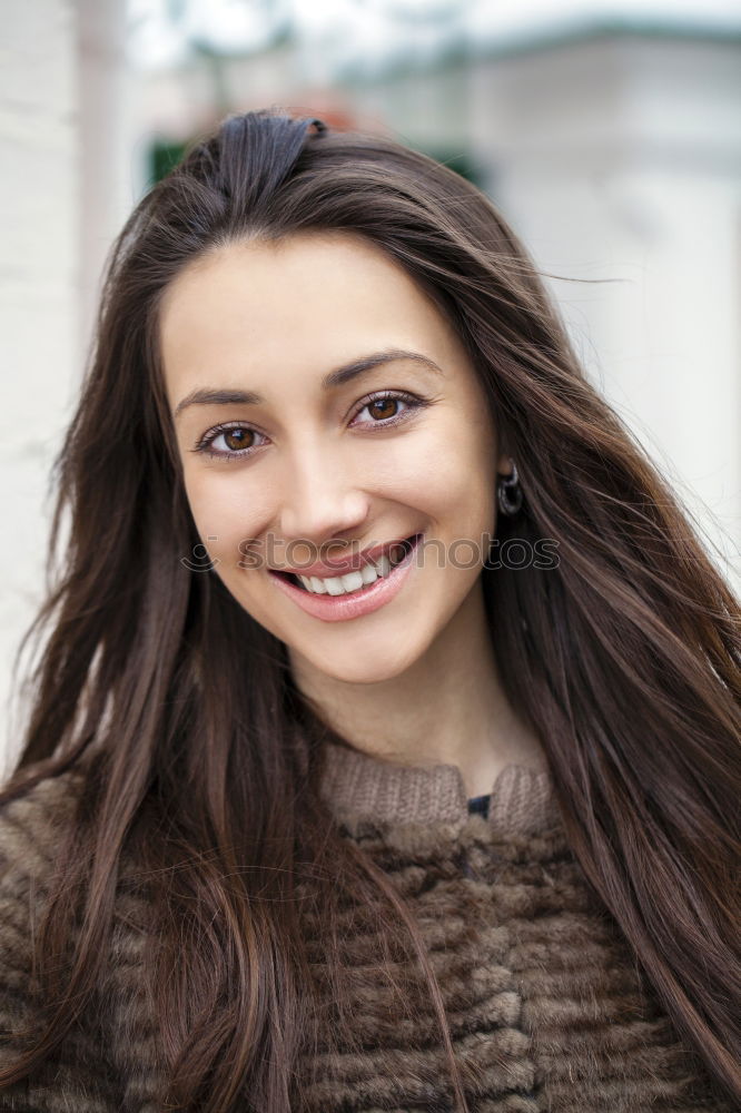 Similar – Young woman smiling in urban background