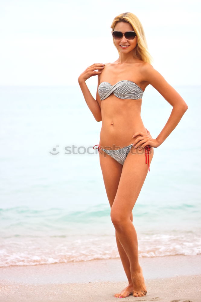 Similar – Image, Stock Photo Woman with beautiful body enjoying her bath on the beach