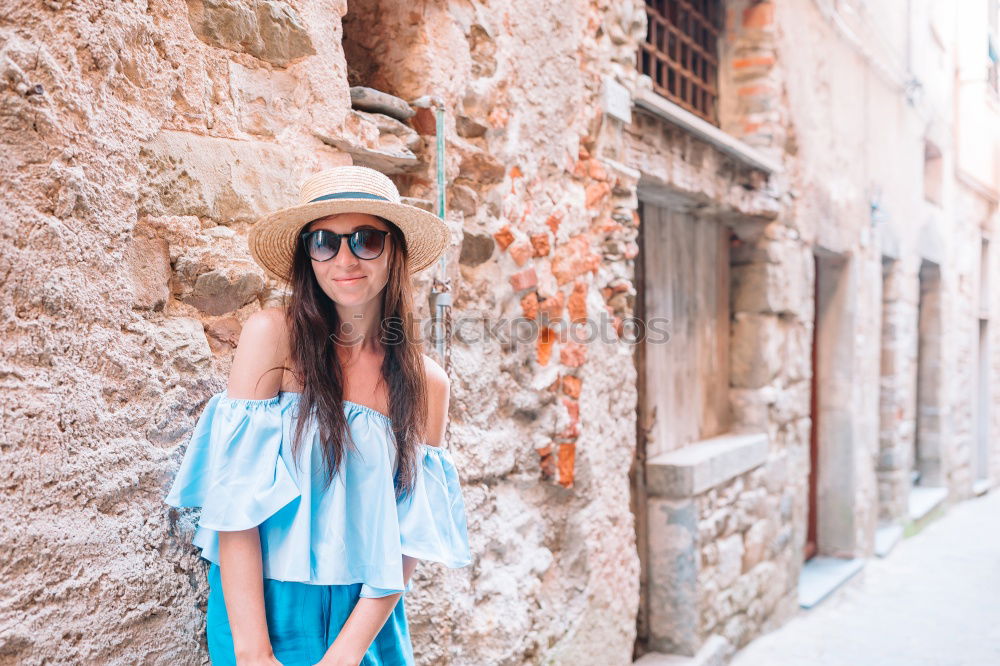 Similar – Young woman in yellow dress walking by the city