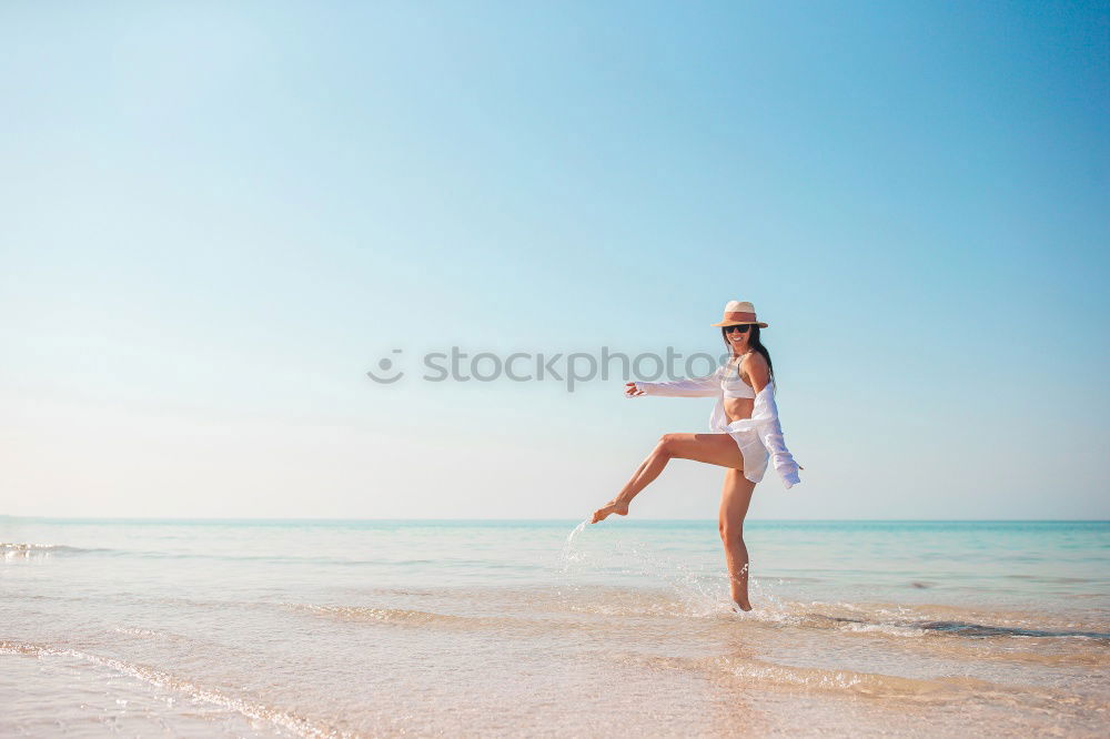 Similar – Happy teen girl jumping on the beach