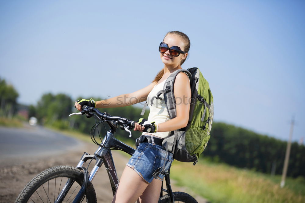 Similar – Image, Stock Photo Woman riding bike looking at camera