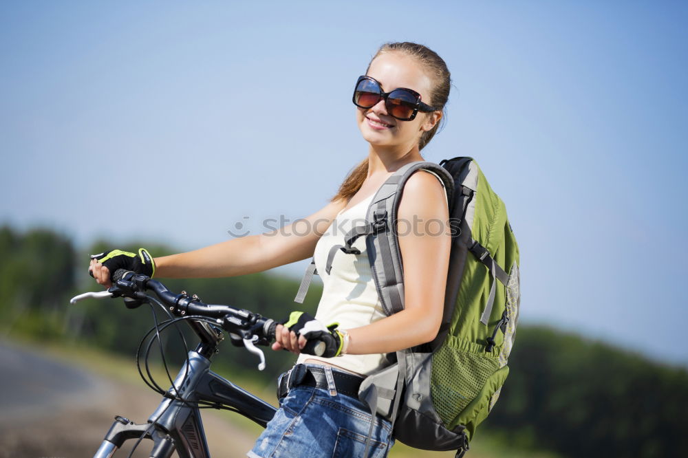 Similar – Image, Stock Photo Woman riding bike looking at camera