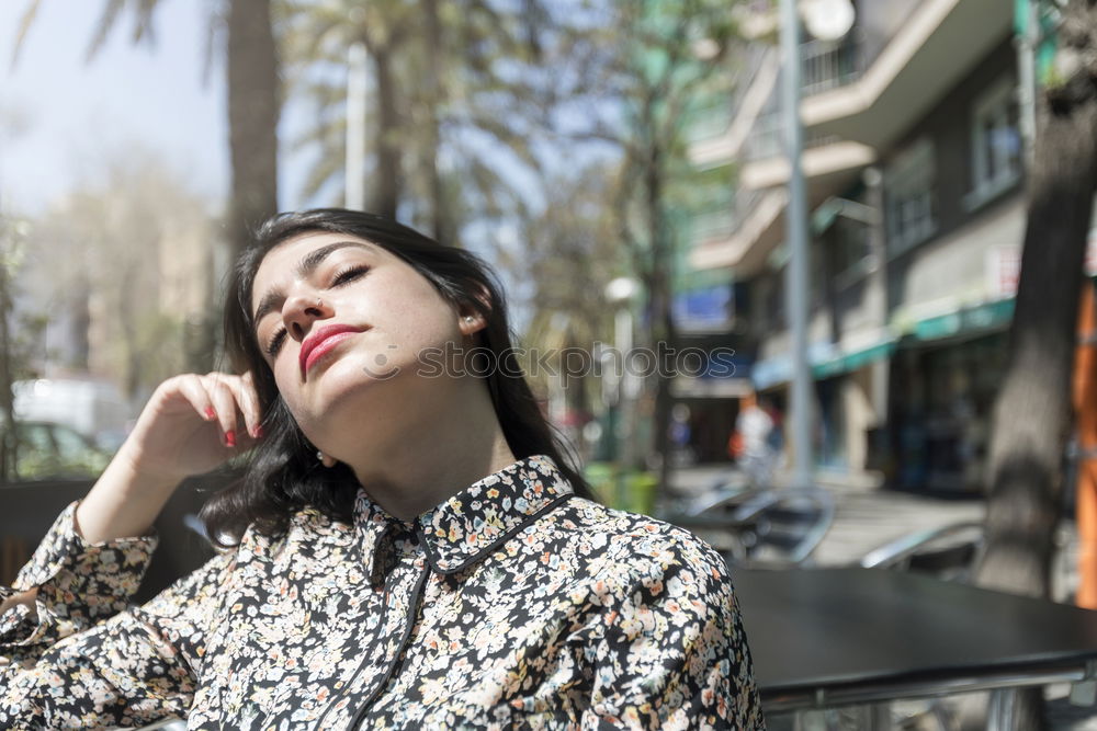 Similar – Thoughtful woman at lamp post