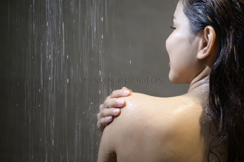 Similar – Woman using a peeling glove in a shower