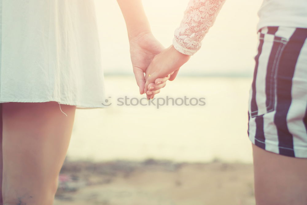 Similar – Two little kids holding her hands on a summer day