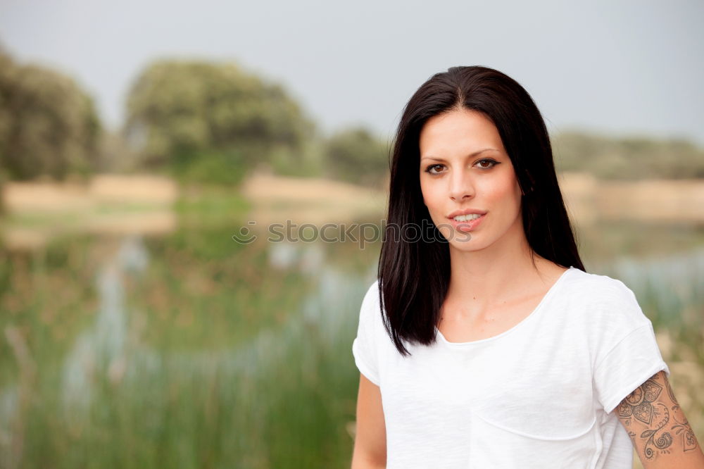 Similar – Image, Stock Photo Beautiful brunette in white on green