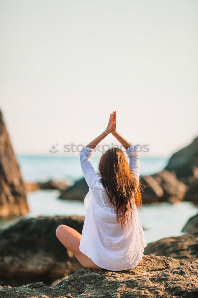 Similar – Rear view of young black woman doing yoga in the beach