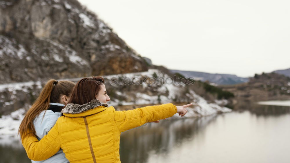 Image, Stock Photo Woman sitting on stone at lake