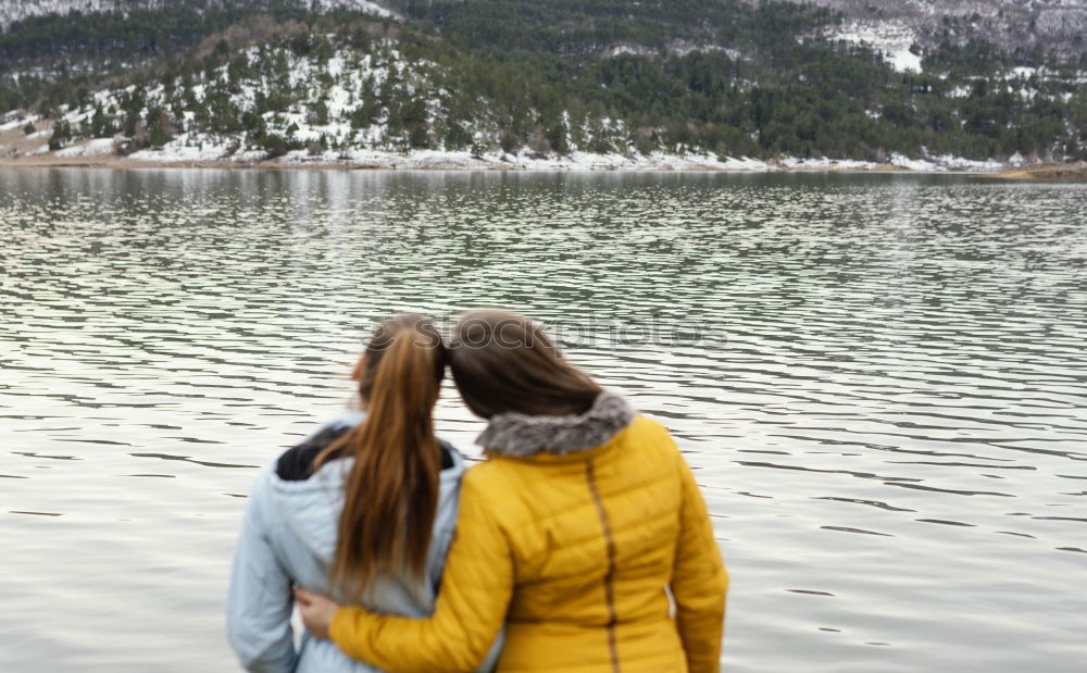 Similar – Women at lake in mountains