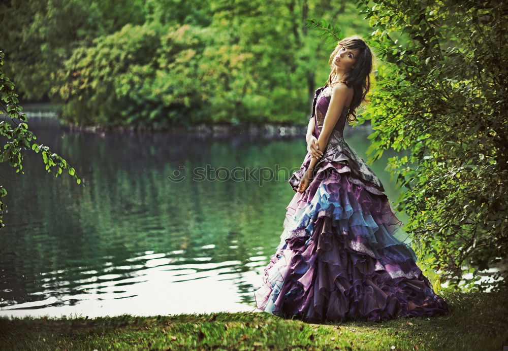 Similar – Image, Stock Photo Young tall woman in purple/purple wedding dress in forest