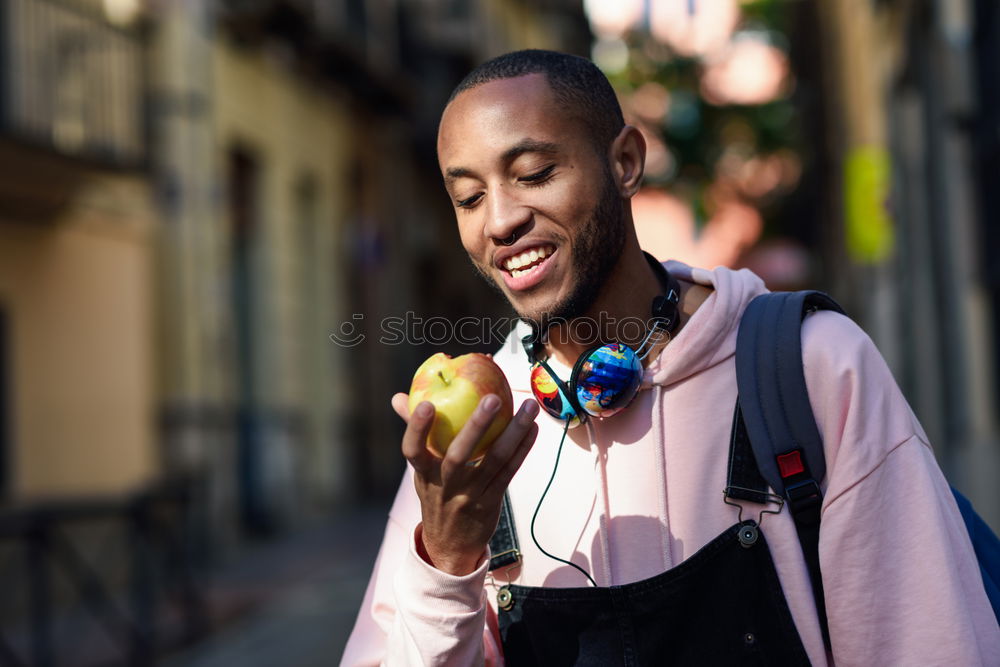 Similar – Image, Stock Photo Young black man wearing casual clothes walking smiling down the street