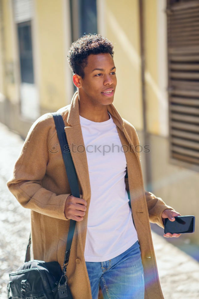 Similar – Image, Stock Photo Young black man using smart phone outdoors