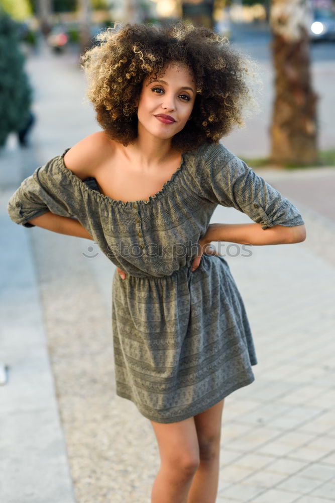 Similar – Young woman curly hairstyle with casual clothes in the street