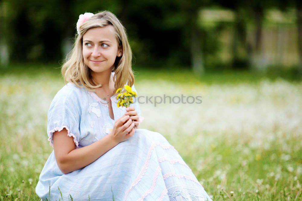 Similar – romantic portrait of happy child girl picking bouquet of beautiful blue delphinium flowers from summer garden