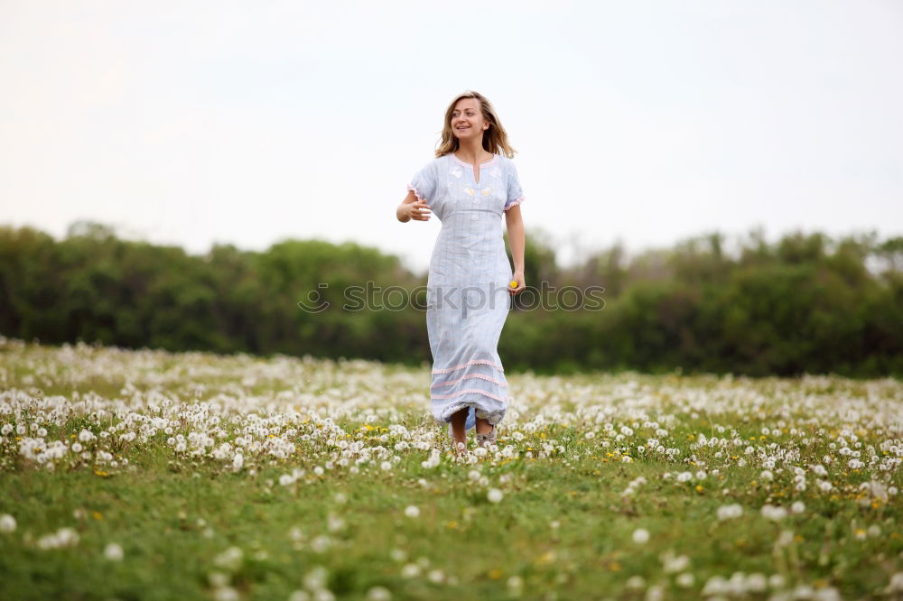 Similar – Image, Stock Photo Portrait of tall beautiful woman with long dark curly hair in forest