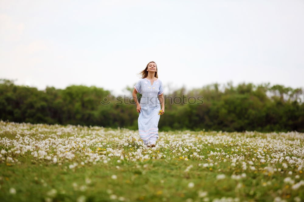 Similar – Young woman in forest behind trees