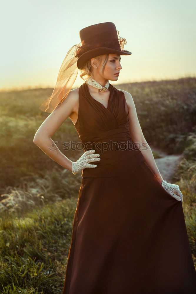 Similar – Image, Stock Photo Pensive bride with a red suitcase on the train tracks